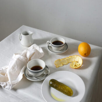 Dill Pickle PR Image 2021 A table set with coffee and a dill pickle