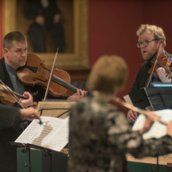 Tracy Kraus, Peter Sulski and Rohan Gregory perform